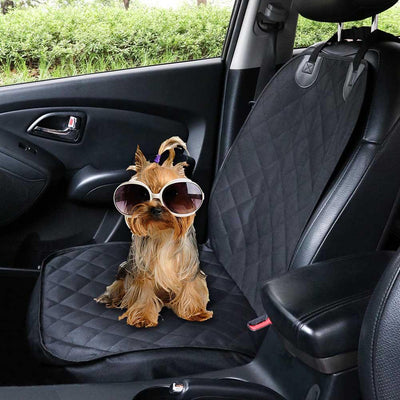 Black quilted pet car seat cover installed on a front passenger seat, protecting the upholstery. - Image 6