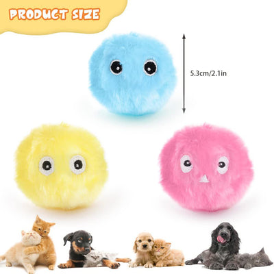 Three plush interactive cat toy balls in blue, yellow, and pink, each with cartoon eyes, shown with a size measurement.