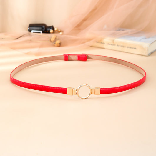 Black imitation leather belt with a glossy finish and a gold-tone round double buckle. - Image 12