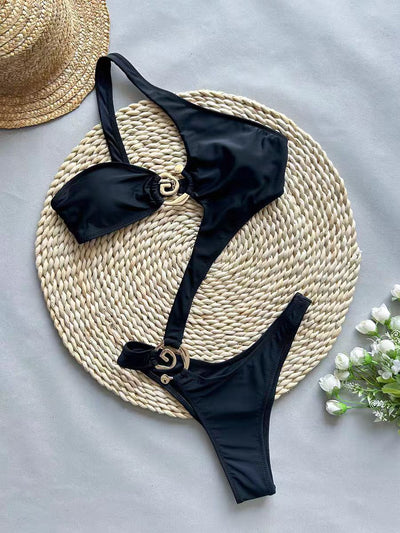 Black one-piece swimsuit with asymmetrical cutout design and gold-toned ring details, featuring a high-cut bottom. - Image 8