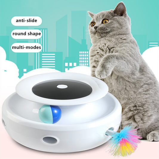 Grey and white cat observing a blue electric cat toy with a feather attachment and glowing blue lights.
