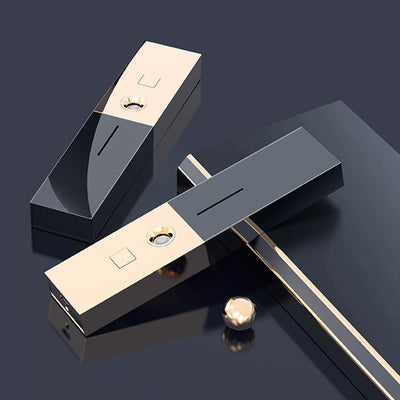 Two sleek black and gold nano spray water replenishing instruments on a dark, reflective surface. - Image 2