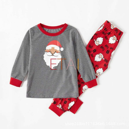 Children's grey and red long-sleeve pajama set with Santa Claus graphic on top and repeating Santa pattern on pants. - Image 13
