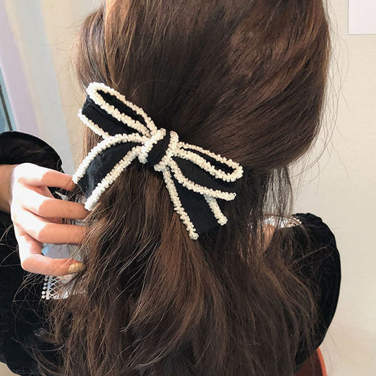 Diadema Elegante con Moño Blanco y Detalles Perlados - Image 2