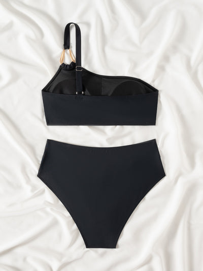 Black one-shoulder bikini with a gold-tone metal buckle detail and high-waisted bottoms with a V-front design. - Image 17
