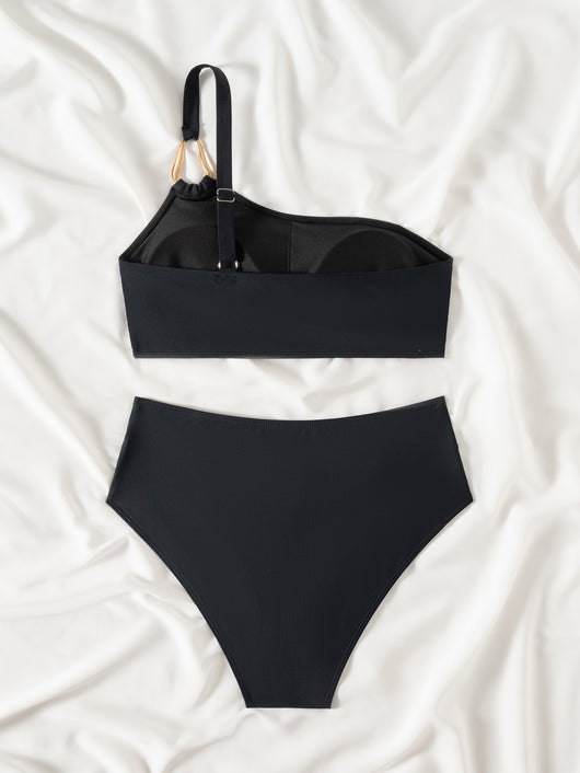 Black one-shoulder bikini with a gold-tone metal buckle detail and high-waisted bottoms with a V-front design. - Image 17