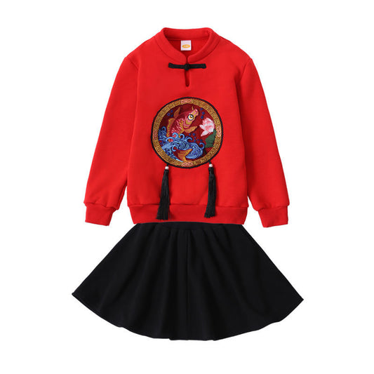 Family of four in matching red long-sleeve tops with a rabbit graphic, celebrating the Year of the Rabbit. - Image 2