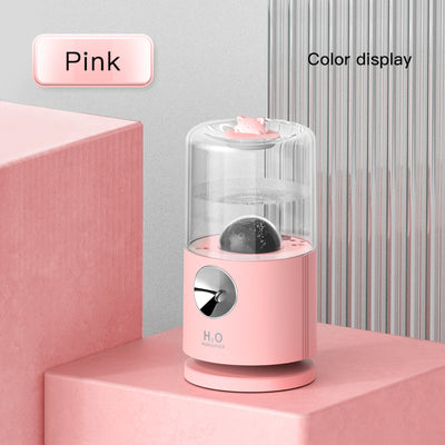 Light blue smart rotary projection humidifier with a clear water tank and a cute cat-shaped top. - Image 7