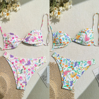 White ribbed two-piece bikini with colorful floral print, featuring a bandeau top and high-cut bottom.