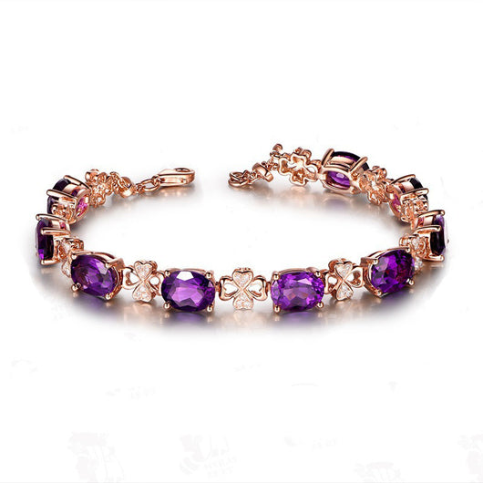 Rose gold necklace with a teardrop purple gemstone pendant and matching dangle earrings. - Image 9