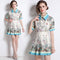 Conjunto de Blusa Estampada y Falda Plisada