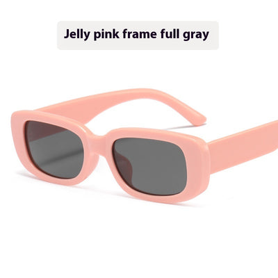 Children's small frame oval sunglasses with a solid white PC frame and brown AC lenses for UV protection. - Image 8