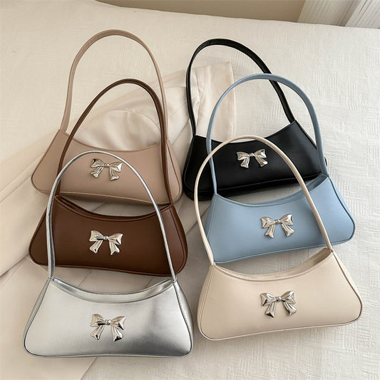 Bolsa de Hombro Minimalista Texturizada con Detalle de Moño Elegante
