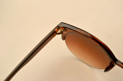 Half frame cat eye retro sunglasses with brown gradient lenses and a tortoiseshell-patterned frame. - Image 9