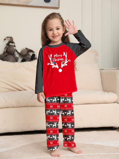Family of four wearing matching red and black Christmas pajamas with a deer head and "Merry Christmas" print. - Image 12