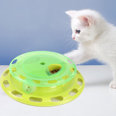 Green and yellow two-tier interactive cat toy turntable with a bell ball in the track and kibble in the top compartment. - Image 3