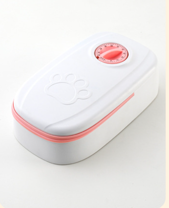 White automatic pet feeder with a pink timer dial and an embossed paw print on the lid. - Image 11
