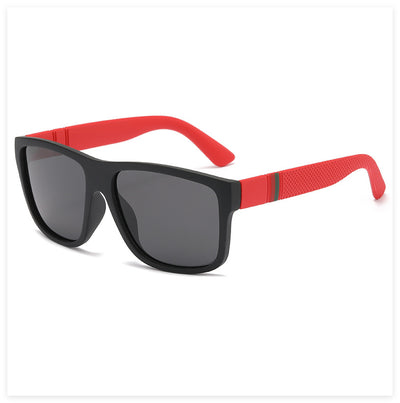 Men's grey plastic frame driving sunglasses with dark polarized lenses and red and black stripe detail on temples. - Image 9