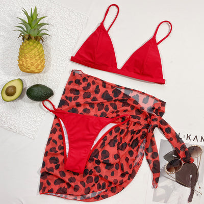 Red bikini top with matching red and black leopard print sarong skirt, part of a three-piece swimsuit set. - Image 10