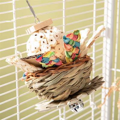 Colorful parrot bird toy with a woven basket base, braided chew sticks, crinkled paper, and a metal hanging chain. - Image 4