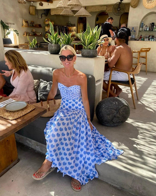 White shorts with blue heart print and ruffled sides, perfect for a fun vacation or casual summer day. - Image 70