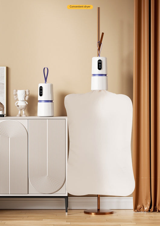 White and blue mini household air dryer with a digital display and hanging loop, shown next to a gold smartphone. - Image 18