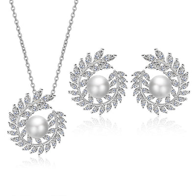 Elegant pearl and cubic zirconia jewelry set with a necklace and two earrings, featuring a wreath design. - Image 5