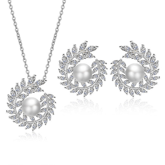 Elegant pearl and cubic zirconia jewelry set with a necklace and two earrings, featuring a wreath design. - Image 5