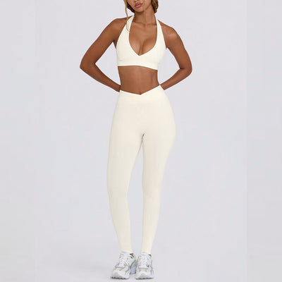 Light pink halter neck sports bra and high-waisted leggings workout set on a model. - Image 14