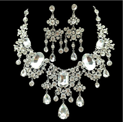 Sparkling rhinestone and crystal bridal jewelry set with a statement necklace and matching chandelier earrings. - Image 5