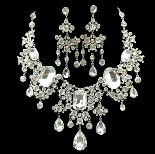 Sparkling rhinestone and crystal bridal jewelry set with a statement necklace and matching chandelier earrings. - Image 5