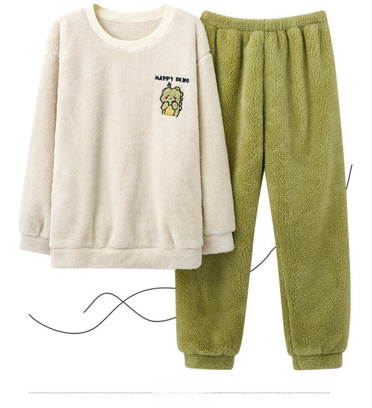 Couple wearing matching cream coral fleece pajamas with gray pants and bear embroidery, seated on a bed. - Image 18