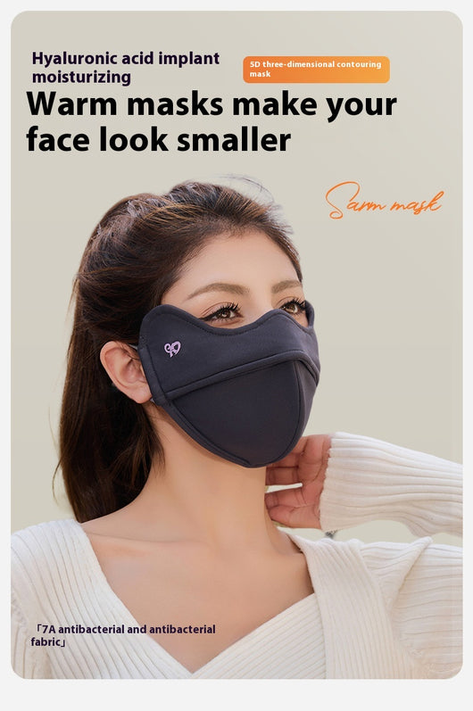 Woman wearing a grey outdoor cycling wind mask with ear hooks and a small heart logo, designed for cold-proof eye protection. - Image 24