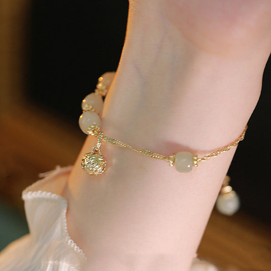 Pulsera de Jade Hetian Natural con Diseño Étnico Tradicional - Image 2