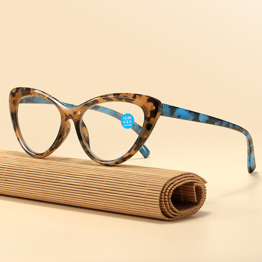 Black cat-eye anti-blue light reading glasses with green patterned temples on a white background. - Image 2