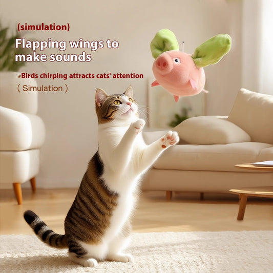 Pink plush pig cat toy with green wings, featuring sound and vibration, 15.5cm long, with USB charging. - Image 2