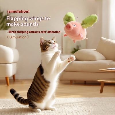 Pink plush pig cat toy with green wings, featuring sound and vibration, 15.5cm long, with USB charging. - Image 2