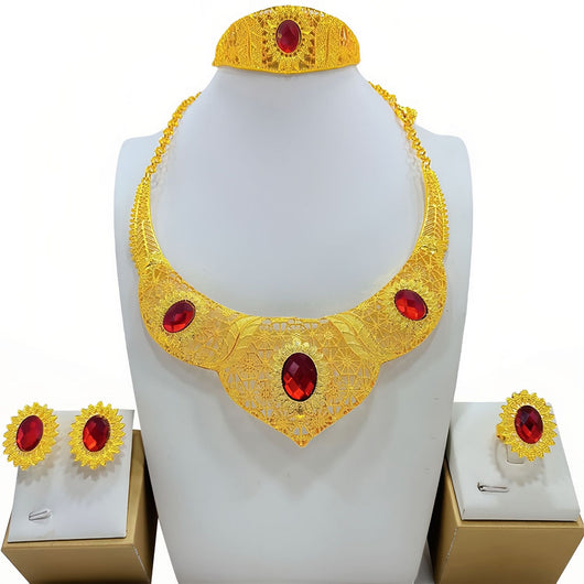 Golden jewelry set with a wide necklace, cuff bracelet, stud earrings, and ring, all featuring blue oval gemstones and intricate filigree patterns. - Image 2