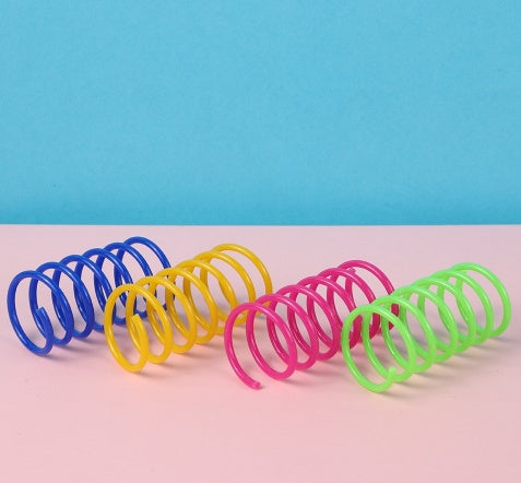 Colorful plastic spring cat toys in pink, yellow, green, and blue, packaged in a clear plastic bag. - Image 13