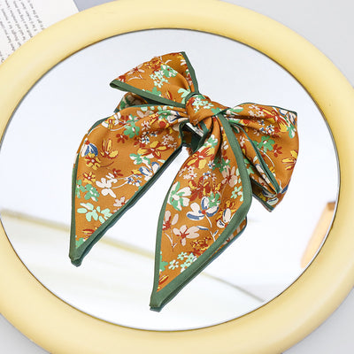 Clip Primavera para Coleta con Moño de Tela Estampada - Accesorio para Cabello Elegante