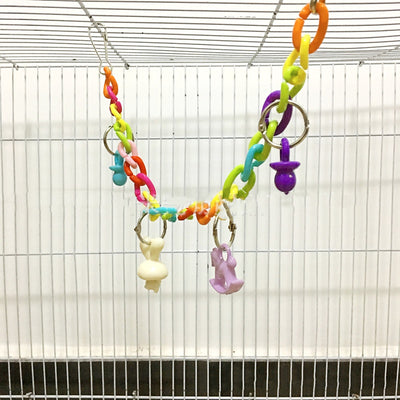 Colorful acrylic chain suspension bridge swing toy with hanging charms for parrots, installed in a white bird cage. - Image 8