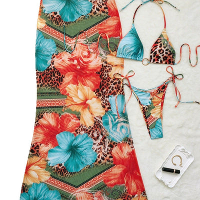 Leopard print and hibiscus floral bikini set with sheer maxi cover-up dress in red, orange, blue, and green. - Image 5