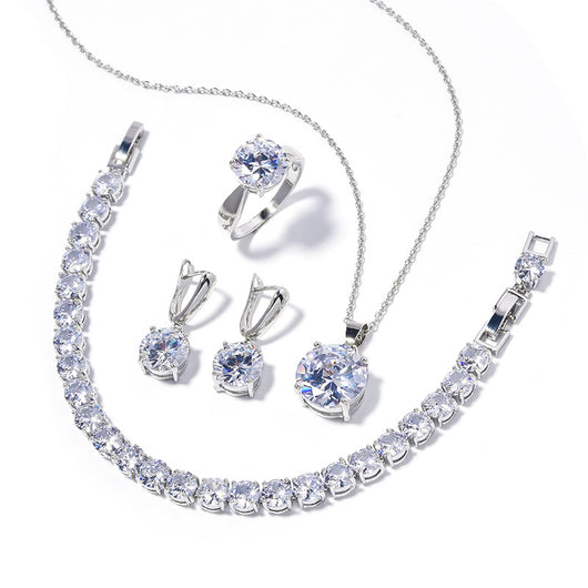 Four-piece jewelry set with silver-toned metal and round deep pink gemstones, including a necklace, bracelet, ring, and earrings. - Image 6