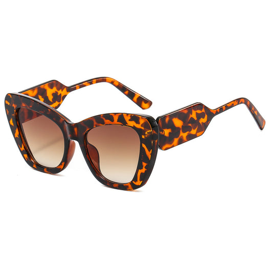 Pink cat-eye sunglasses with green temples and brown to pink gradient lenses on a white background. - Image 6