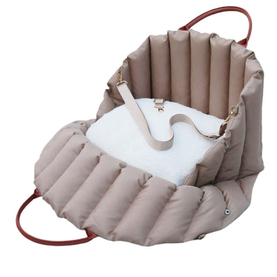 Light khaki quilted portable pet carrier with brown handles and a cream shoulder strap for car travel. - Image 5