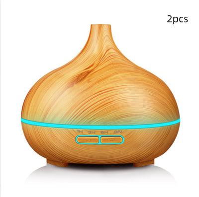 Wood grain ultrasonic aromatherapy diffuser and humidifier with a glowing blue LED light band and control buttons. - Image 9