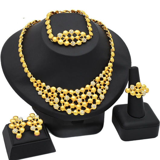 Women's four-piece gold-tone jewelry set with floral designs, including a necklace, bracelet, ring, and earrings. - Image 6