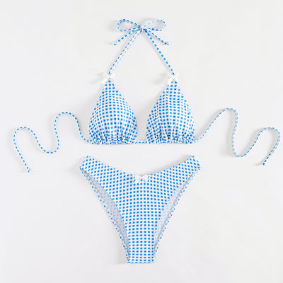 Red and white gingham print bikini swimsuit with a triangle halter top and high-cut bottom, featuring small white bows.