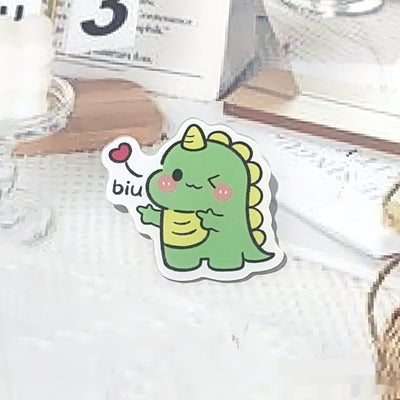Cute green cartoon dinosaur acrylic badge brooch with a shy expression and small spikes on its back. - Image 16