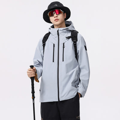 Man wearing a black windproof and waterproof outdoor jacket with a hood, sports sunglasses, and a bucket hat, holding a trekking pole. - Image 3